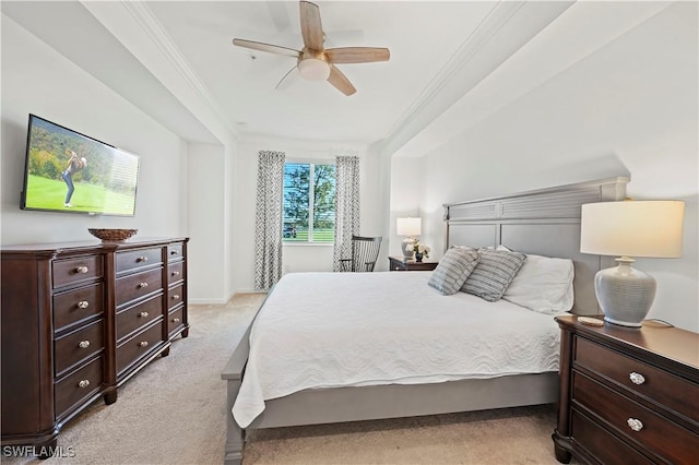 carpeted bedroom with ceiling fan and crown molding