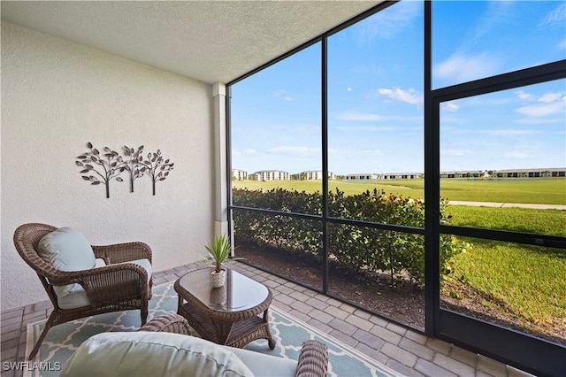 sunroom with a rural view