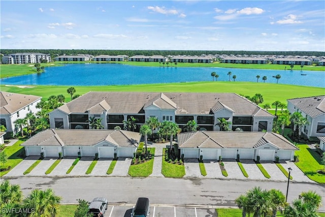 birds eye view of property with a water view