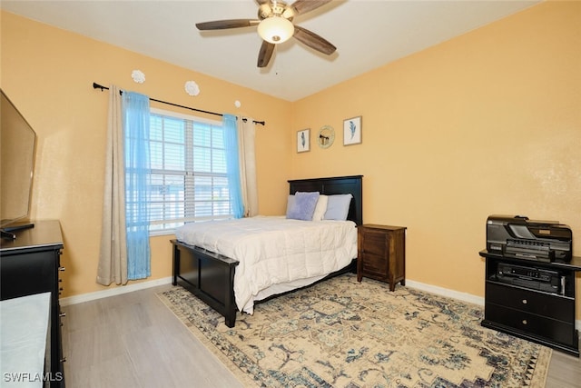 bedroom featuring ceiling fan and light wood-type flooring