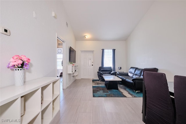 living room with lofted ceiling