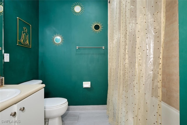 bathroom featuring tile patterned floors, vanity, and toilet