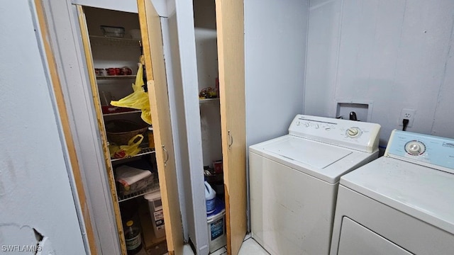 laundry room featuring washing machine and dryer