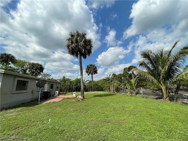 view of yard with central AC