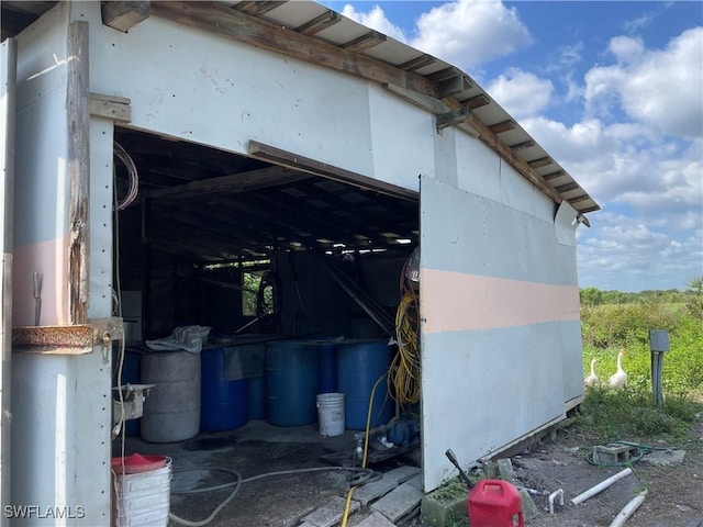 view of home's exterior featuring an outbuilding