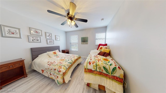 bedroom featuring ceiling fan and light hardwood / wood-style flooring