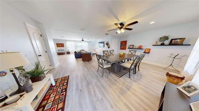 dining area featuring ceiling fan and light hardwood / wood-style floors