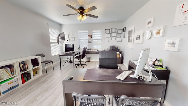 office area with ceiling fan and light hardwood / wood-style floors