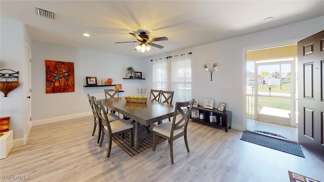 dining space featuring ceiling fan and light hardwood / wood-style floors