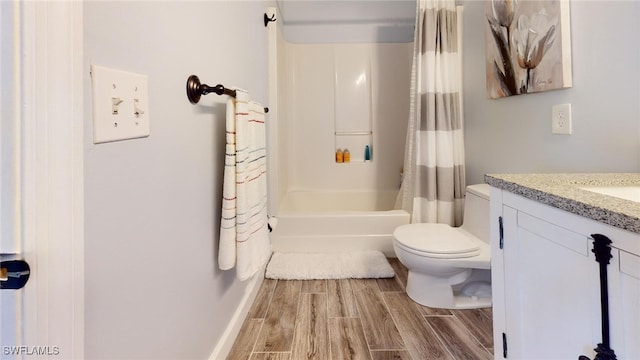 full bathroom featuring shower / bath combo with shower curtain, toilet, and vanity