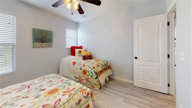 bedroom featuring ceiling fan and light hardwood / wood-style floors