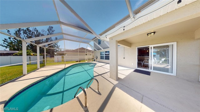 view of swimming pool featuring a patio and glass enclosure