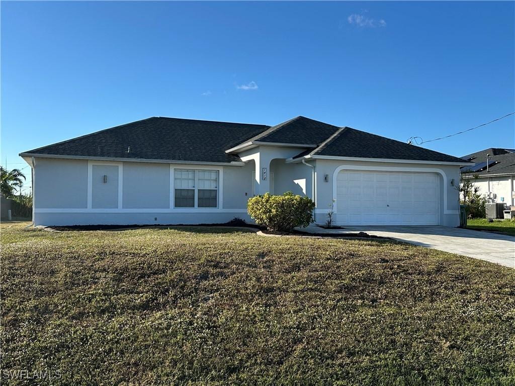 single story home featuring a front lawn, central AC unit, and a garage