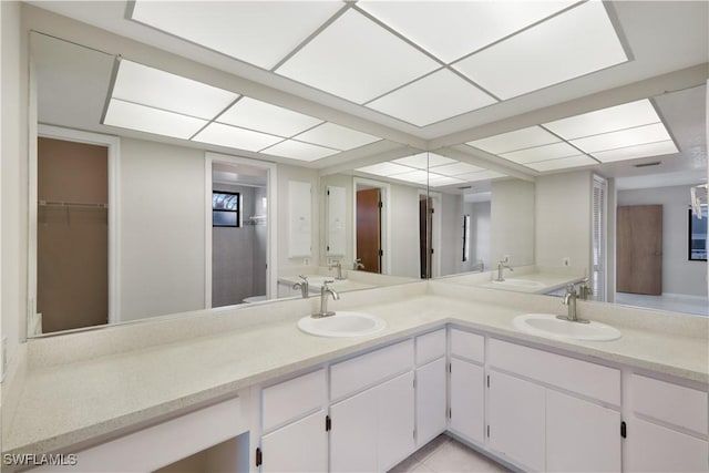 bathroom featuring tile patterned floors and vanity