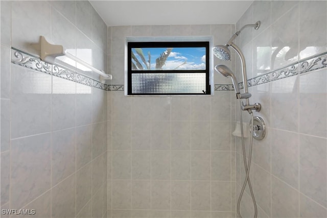 bathroom with a tile shower