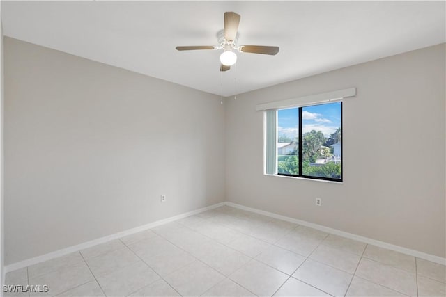 tiled empty room with ceiling fan