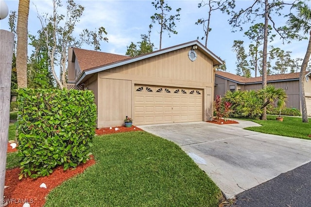 view of front of home featuring a front lawn and a garage