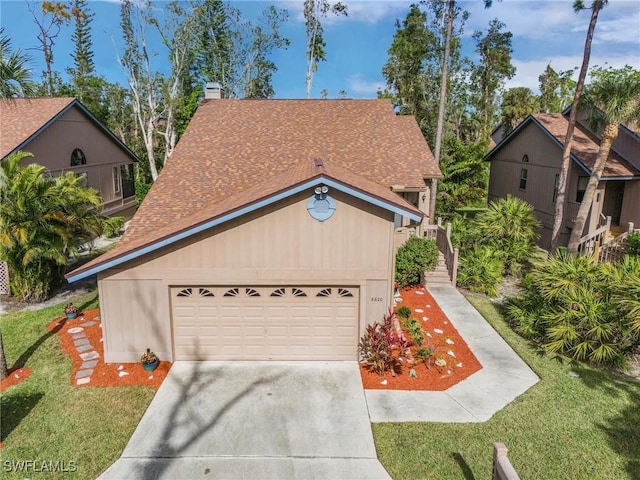 view of front facade with a front lawn and a garage