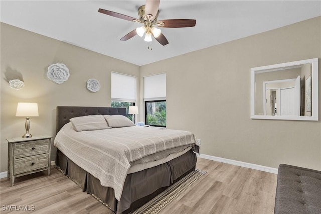 bedroom featuring light hardwood / wood-style floors and ceiling fan