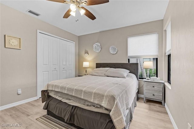 bedroom featuring ceiling fan, a closet, and light hardwood / wood-style floors