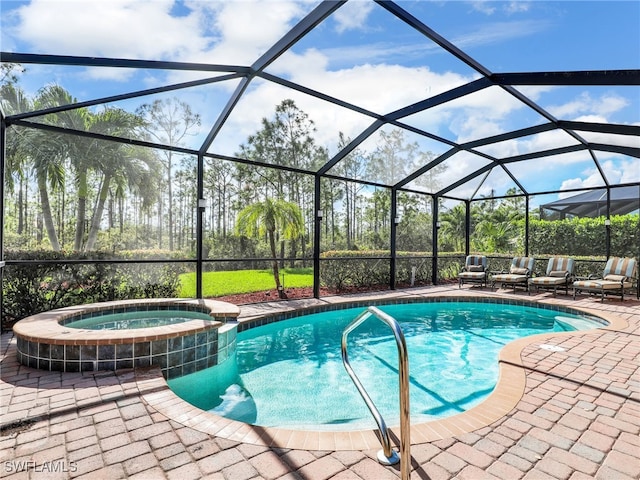 view of pool with glass enclosure and a patio area