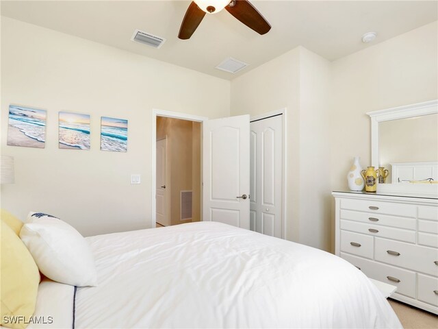 bedroom with ceiling fan and a closet