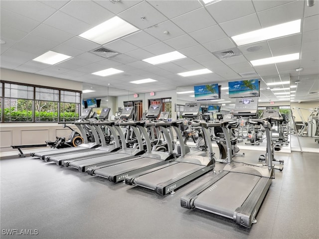 exercise room with a paneled ceiling