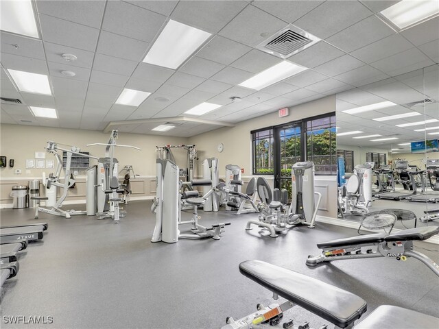 exercise room featuring a drop ceiling