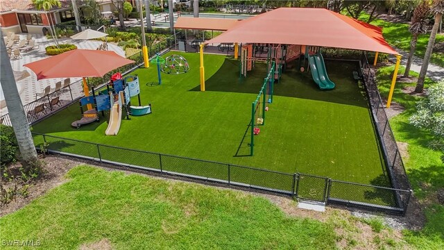 surrounding community with a playground and a yard