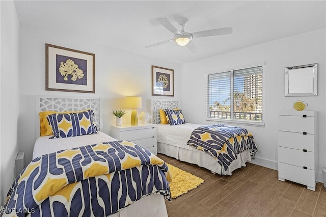 bedroom featuring ceiling fan and hardwood / wood-style flooring