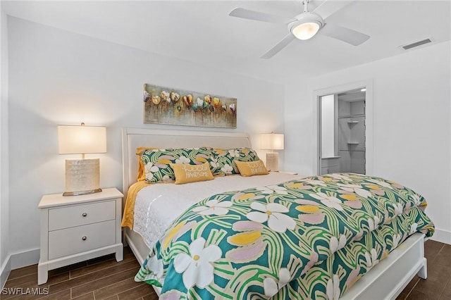 bedroom with ceiling fan, a closet, and a walk in closet