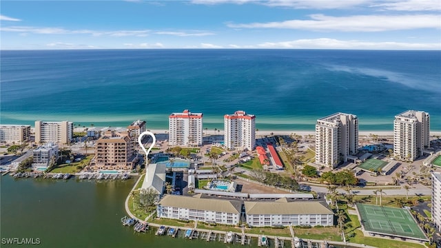 birds eye view of property with a water view