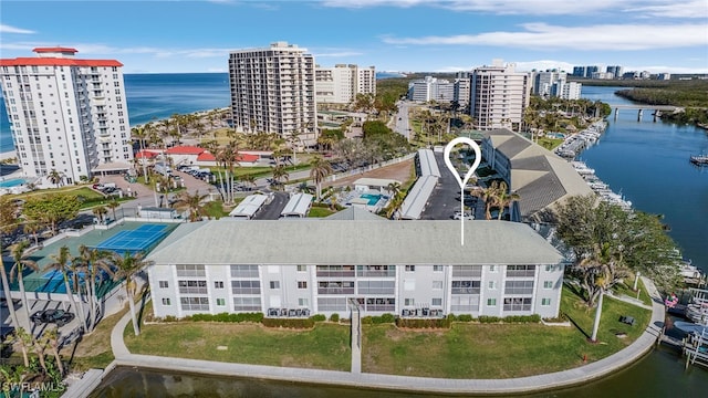 birds eye view of property with a water view