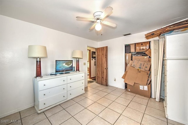 bedroom featuring visible vents, a ceiling fan, and light tile patterned flooring