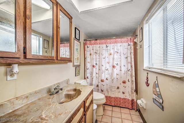 bathroom with toilet, tile patterned flooring, shower / bath combo, and vanity