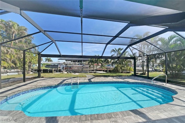 view of pool featuring a lanai and a patio