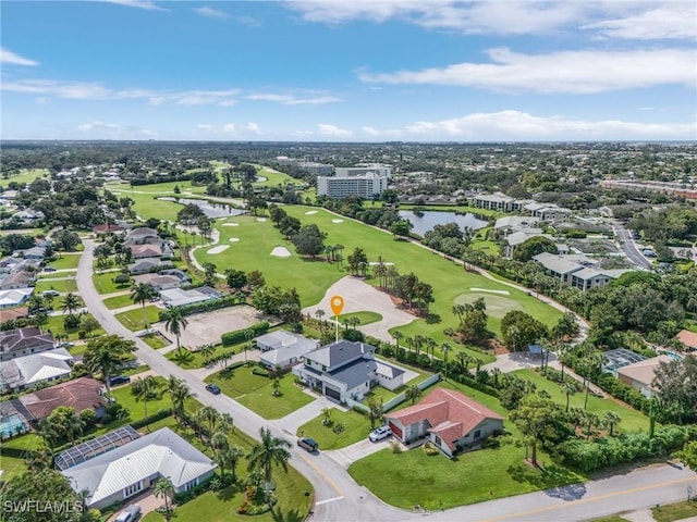 birds eye view of property featuring a water view, golf course view, and a residential view