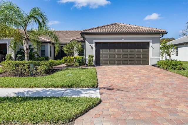 mediterranean / spanish-style house with a garage