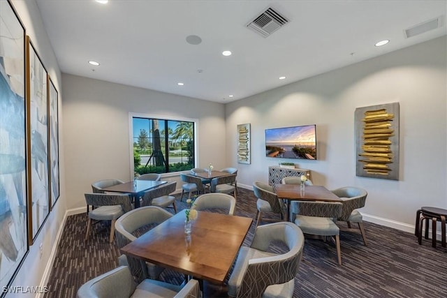 dining room with dark carpet