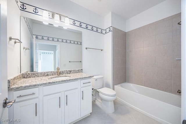 full bathroom featuring tile patterned flooring, vanity, toilet, and tiled shower / bath