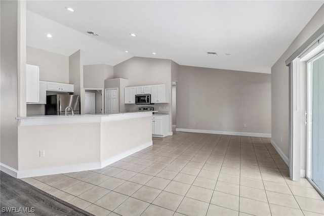 4490 10th St NE, Naples, FL 34120 - kitchen featuring appliances with stainless steel finishes, white cabinetry, light countertops, a peninsula, and recessed lighting