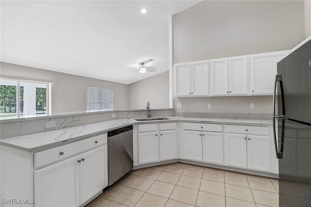 4490 10th St NE, Naples, FL 34120 - kitchen featuring freestanding refrigerator, dishwasher, white cabinets, light stone countertops, and a peninsula