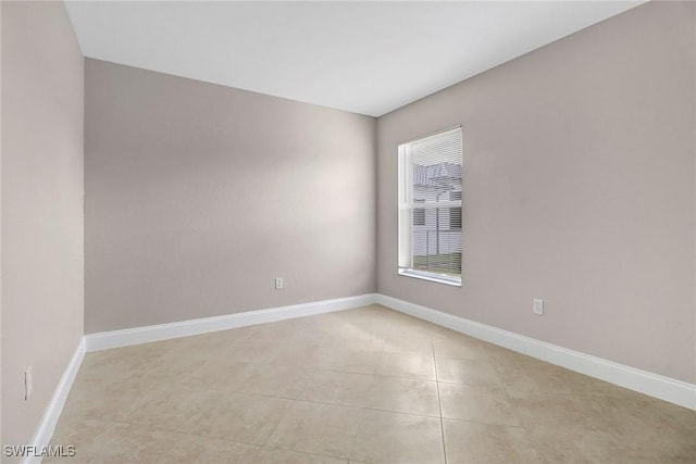 empty room with light tile patterned floors