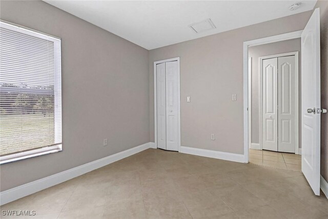 unfurnished bedroom featuring light tile patterned floors