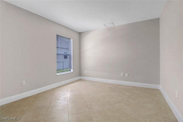 empty room with light tile patterned floors