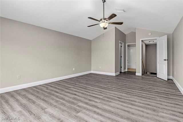 unfurnished bedroom featuring light hardwood / wood-style flooring, ceiling fan, and lofted ceiling