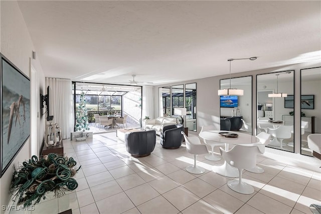 tiled living room featuring ceiling fan