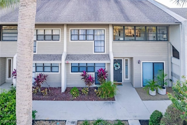 16454 Timberlakes Dr Unit 103, Fort Myers, FL 33908 - view of property with roof with shingles