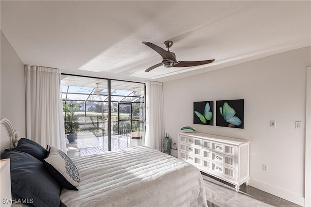 bedroom featuring ceiling fan, a wall of windows, and access to outside