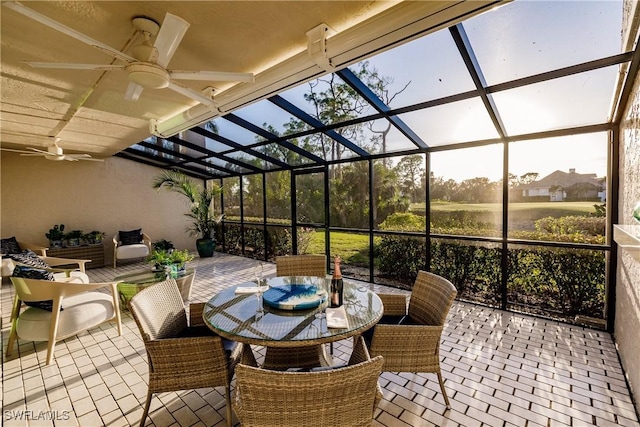 view of patio / terrace featuring a lanai and ceiling fan